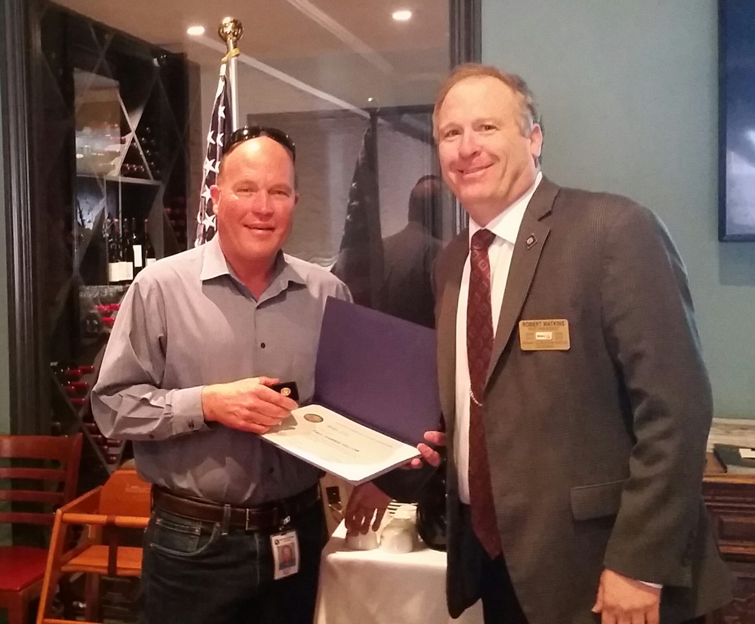 Rotarian Bob Watkins presenting Rotarian Mike Utz his first Paul Harris ...